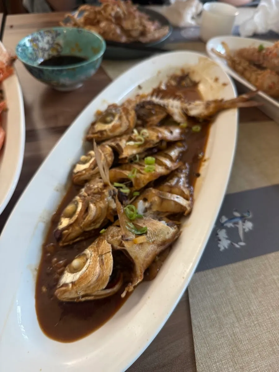 Whole braised fish in a serving dish