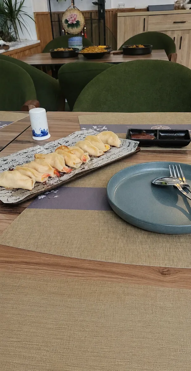 Pot stickers plated on a slate dish