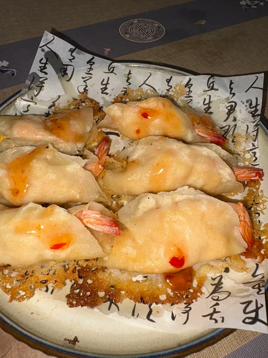Shrimp pot stickers on a calligraphy plate