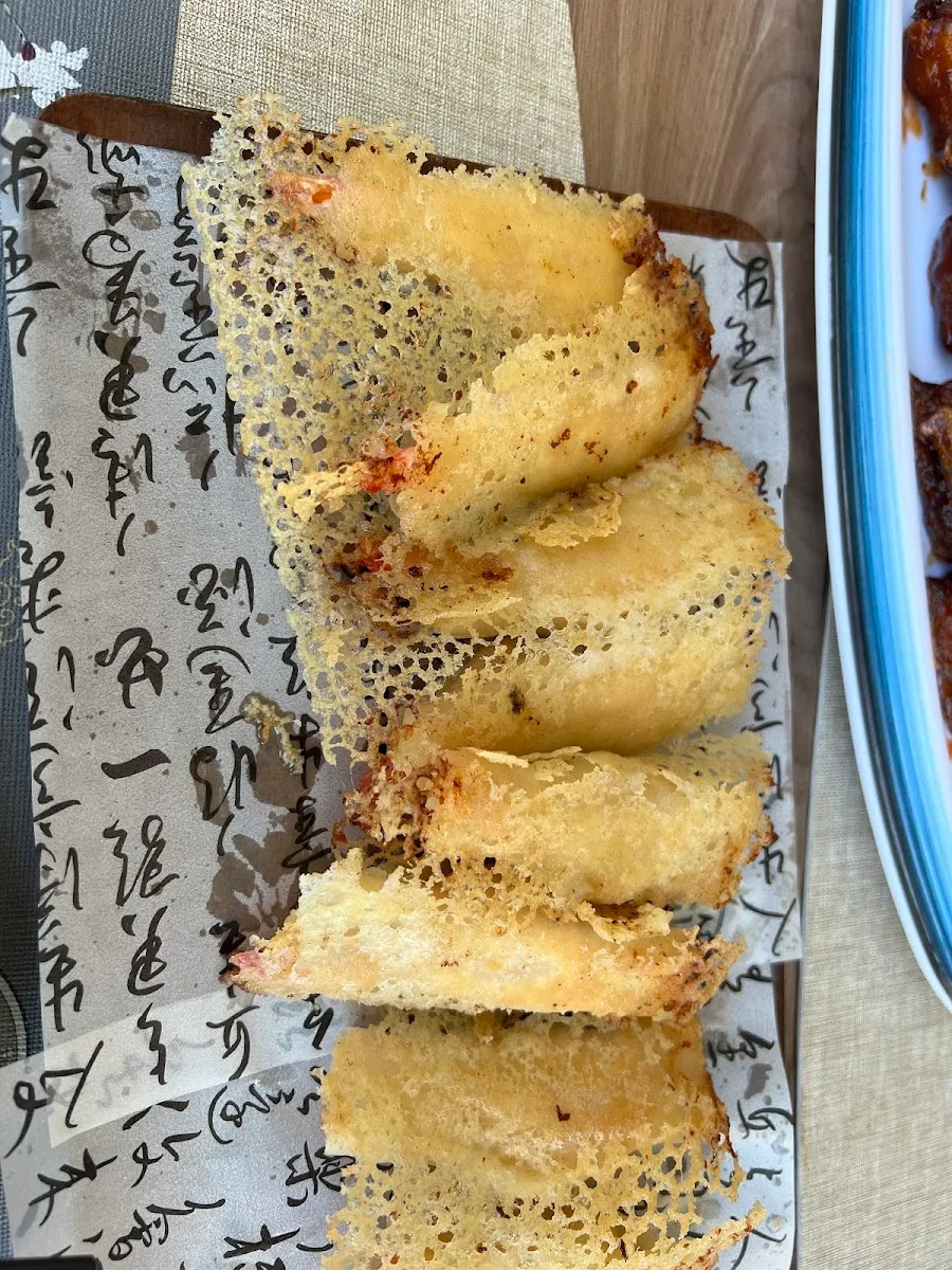 Sesame spring rolls on a calligraphy plate
