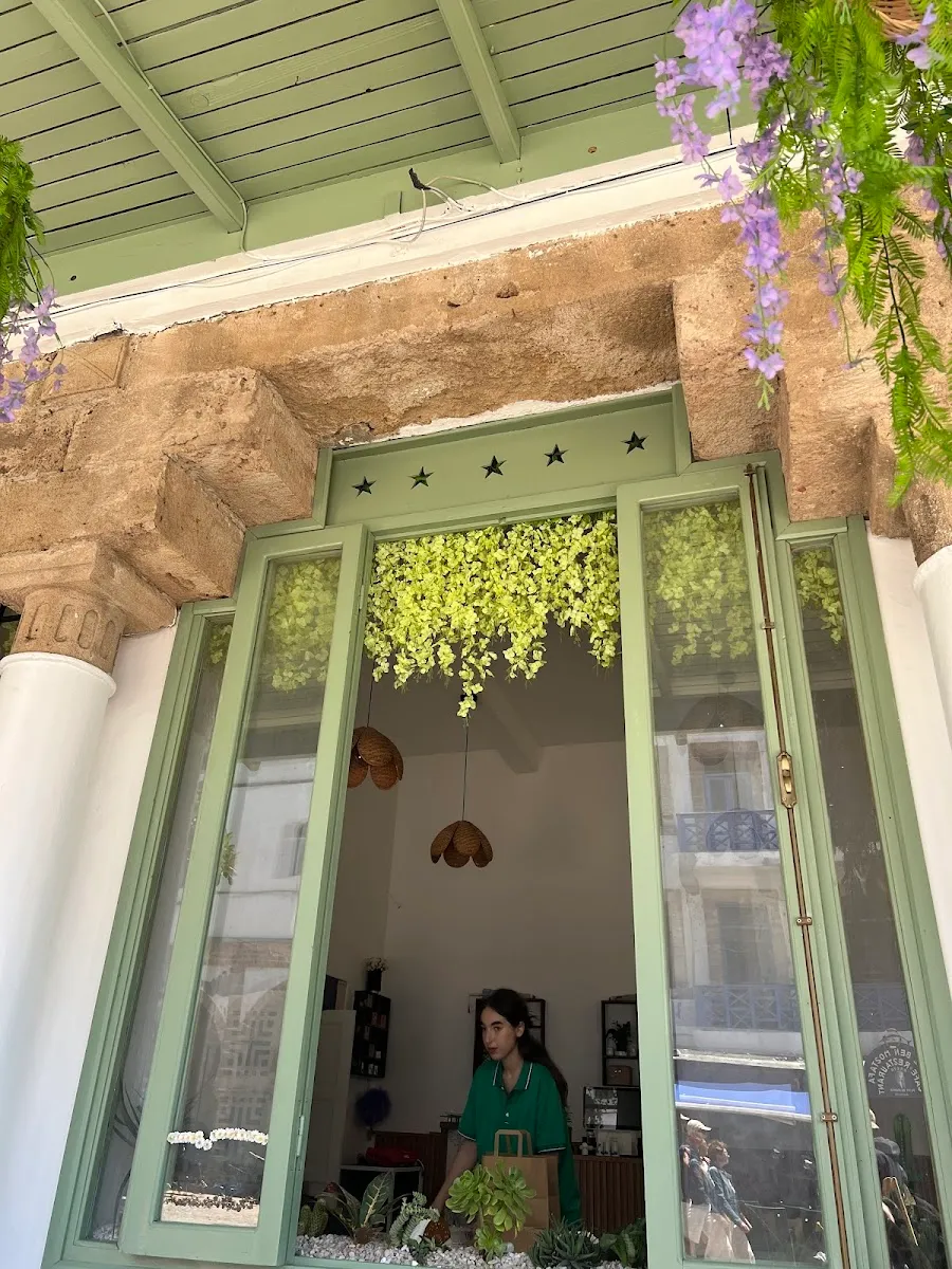 Moroccan cobalt-blue doorway framed by greenery